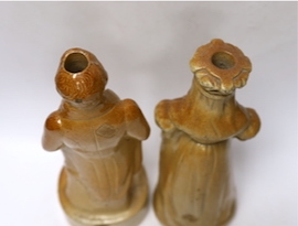 Two Victorian salt glaze spirit flasks, probably Lambeth, the first commemorating the repeal of the Corn Laws in 1846, modelled as Sir Robert Peel and the second modelled as Queen Victoria holding a scroll, impressed 